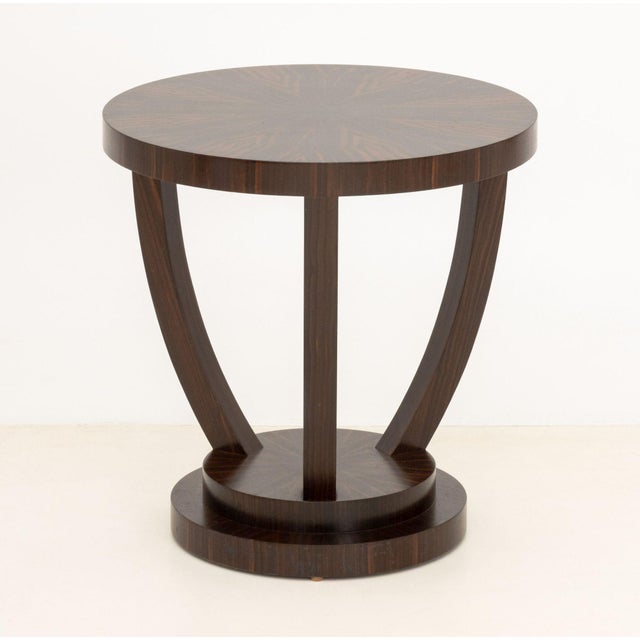 Art Deco Style Macassar Side Table, the circular top on four supports conjoined by undertier. 20.5" H x 20" Diameter....