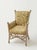Vintage wicker chairs upholstered in Fermoie shell grotto fabric in yellow with removable cushion. Sold as a pair.