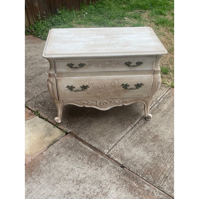 A gorgeous French Provincial Louis XV style carved two-drawer commode or bedside chest of drawers.