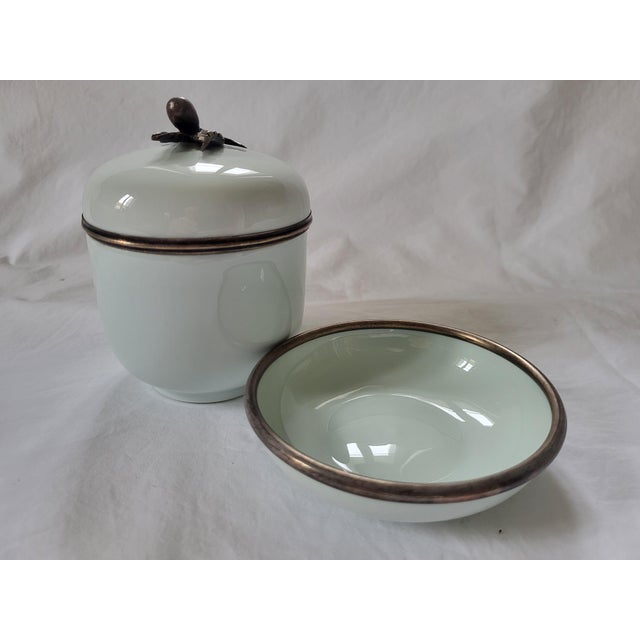 An exquisite, mixed-material decorative porcelain lidded pot and matching saucer set crafted by the historic Royal Limoges...