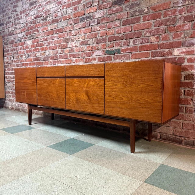 Vintage mid-century Danish modern teak sideboard or credenza in the manner of Ib Kofod-Larsen's iconic Model 66 credenza...
