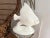 Big beautiful 1970s glazed ceramic Angel fish lamp in creamy white with lifelike fins, eyes, and tail on a raised bed...
