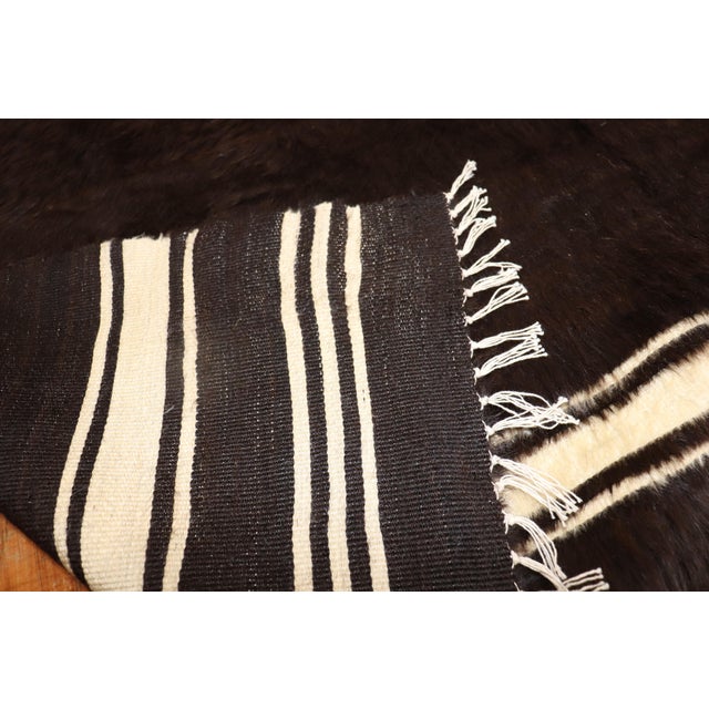 Vintage Angora mohair wool rug in black and ivory. Measures: 5' x 6'7''.