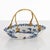 This basket is crafted from ceramic with a classic blue-and-white landscape motif (Chinese artistic elements) and ornate...