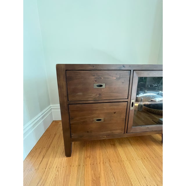 Made of pinewood reclaimed from old pallets, this credenza is expertly refinished joining other statement-making pieces in...