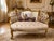 An elegant 1970s French Louis XVI–style corbeille settee, beautifully restored with a carved beechwood frame, warm gilt...