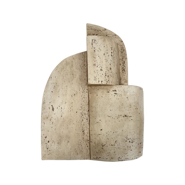 This abstract wall art piece brings depth and dimension to your d?cor. Crafted in a warm stone-inspired finish, its...