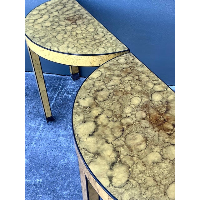 This elegant pair of vintage demilune tables is a masterclass in 1970s Hollywood Regency glamour, offering a sophisticated...