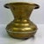 Vintage Early American brass cachepot or planter vessel featuring a classic flared form with engraved detailing and a...