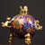 This is a cast bronze cloisonné enamel incense burner (censer) featuring a vibrant purple ground decorated with scrolling...