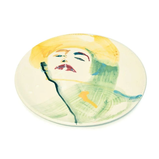 Woman is a colorful hand-made flat ceramic dish, hand-painted and realized by the artist, anastasia kurakina in 2019....