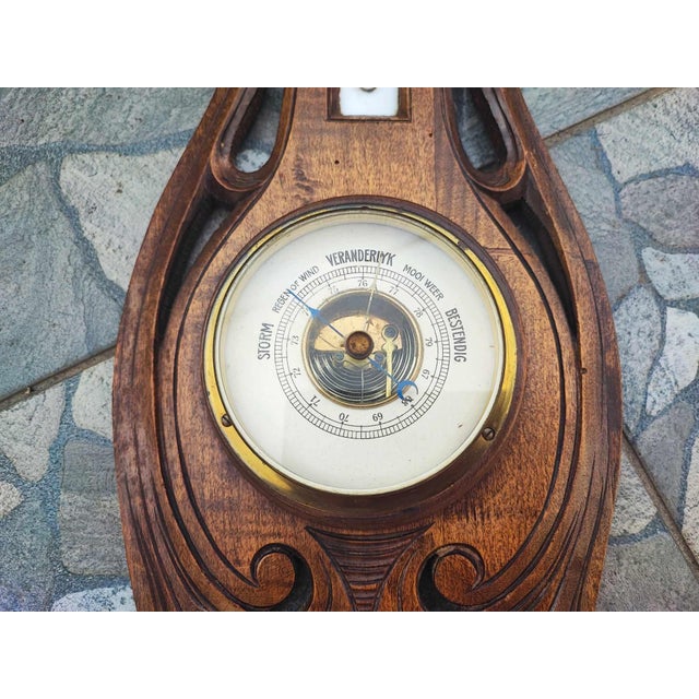 Antique Wooden Barometer & Thermometer, dimensions: height: 49 cm, width at the widest: 18.5 cm, depth: 5.3 cm.