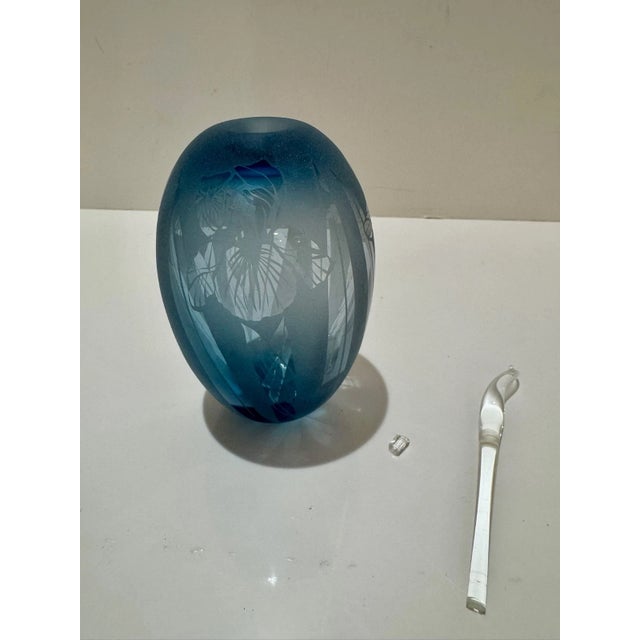 Elegant handblown glass perfume bottle by American studio artist Janet Kelman. This piece features a ribbed, frosted peach...