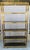 Satin Brass Etegere with six shelves in the design. The design measures 15.25" by 46" overall and 85" tall. The shelves...