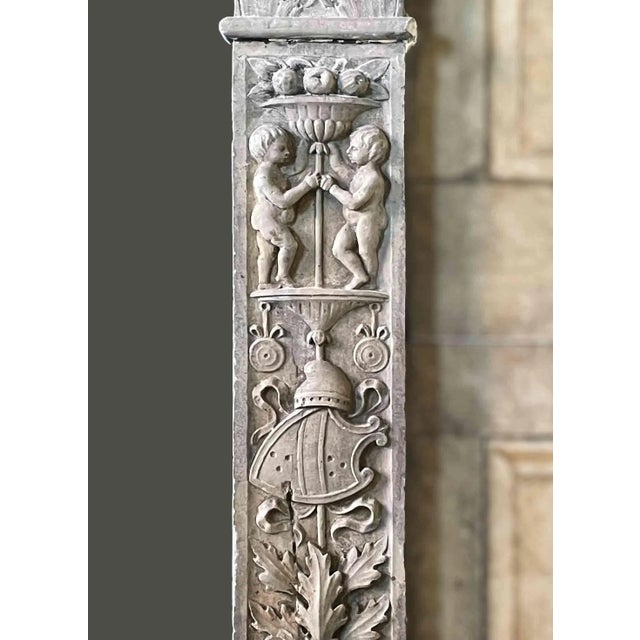 Antique early 20th Century Italian Renaissance style marble mantel having foliate and putti carved Corinthian colonette...