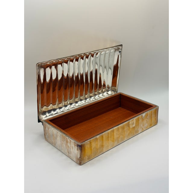 Vintage Ralph Lauren hammered metal cigar case with ribbed lid and wood-lined interior. Heavy, masculine, and beautifully...