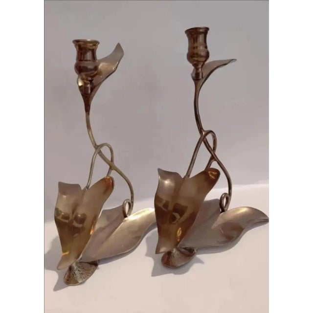 For your consideration. . . A rare pair of fabulous brass candle holders by Dolbi Cashier, circa 1980. This stunning pair...