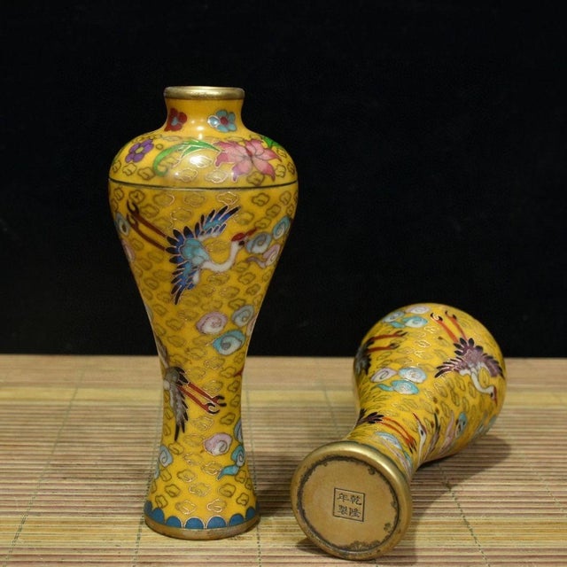 Add a touch of imperial elegance to your space with this exquisite pair of vintage Chinese Cloisonné enamel vases,...