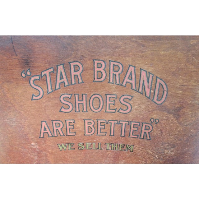 Exceptional and scarce "Star Brand Shoes" folding shoe store fitting chairs. Circa. 1920's. Detailed cast iron frames with...
