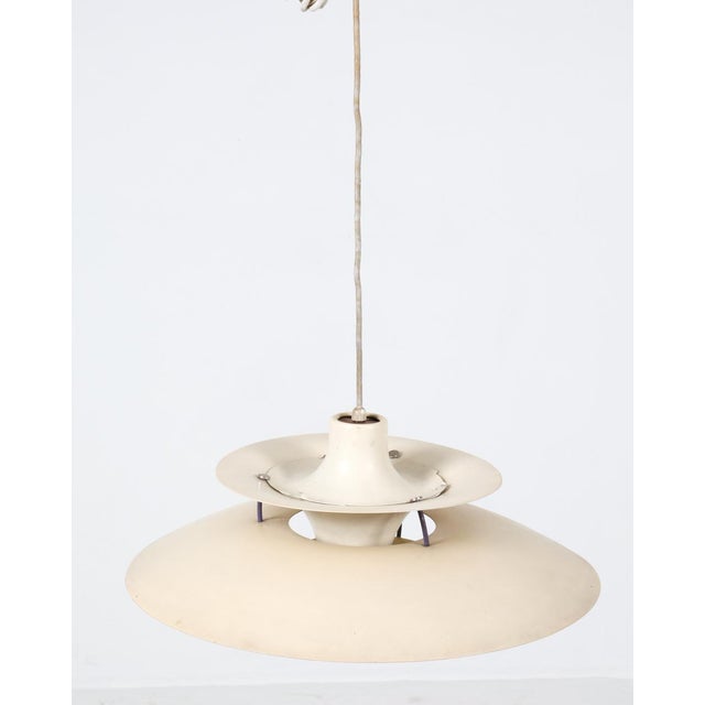 ph5 saucer pendant light designed by poul henningsen for louis poulsen. denmark, circa 1960s. layered aluminum shade in...