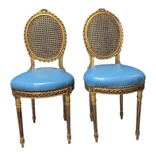 Mid 18th Century French Louis XVI Giltwood Chairs With Italian Blue Leather & Cane Backs — Pair For Sale