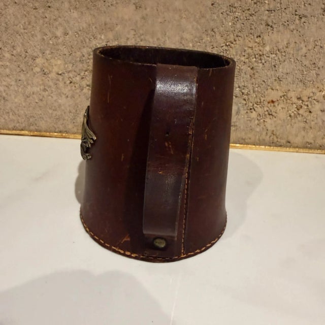 For your consideration, a vintage leather bound cup holder, tankard or stein. Stamped: "Real Hide England". No glass or...