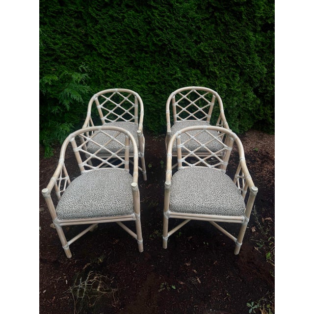 An iconic set of four vintage dining armchairs by McGuire Furniture. Known for its refined use of natural materials,...