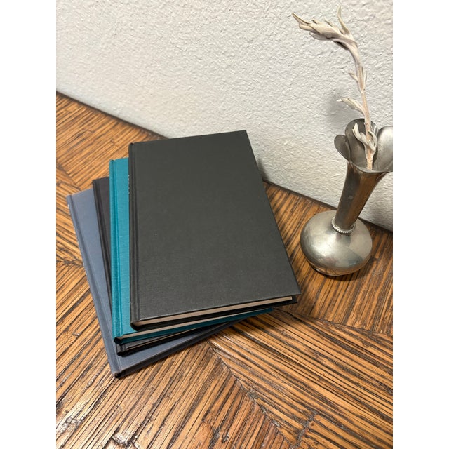 Bring the profound, scholarly atmosphere of an elite university library into your space with this curated 4-book stack of...