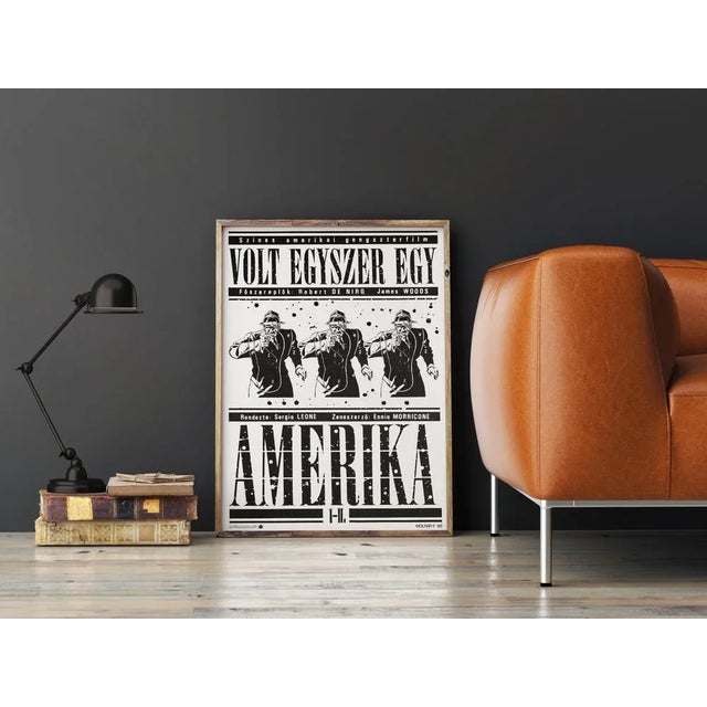 Artist ferenc molnár confronts us with a gun-toting gangster in triplicate on his splattered monochrome poster for the...