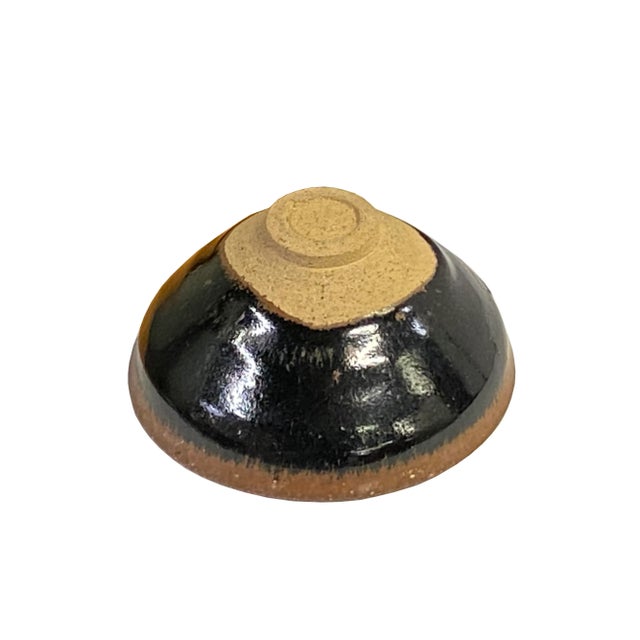 This is a handmade Chinese accent decorative art made of ceramic in brown black mix color with copper tan rim and Chinese...