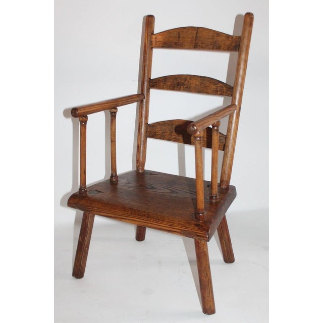Early 19th century ladder back child's chair from New England in fantastic condition. This early chair is mortised and...