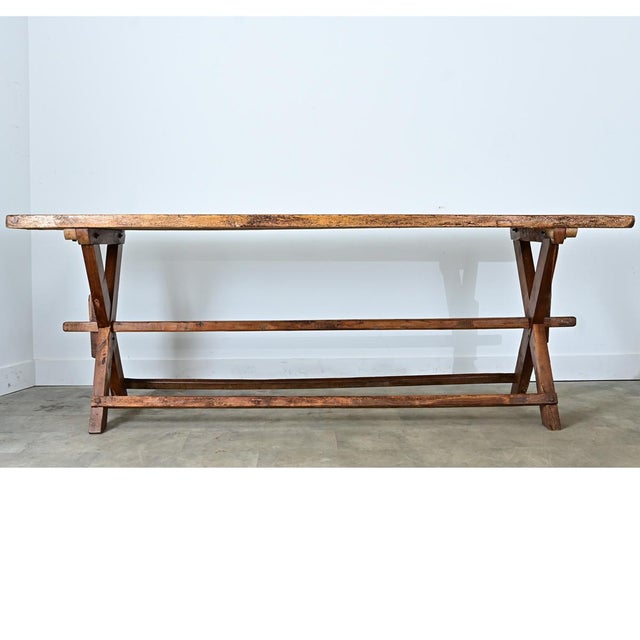 This substantial French cheesemaker's table was crafted from solid pine and oak circa 1870. Its top is made from three...