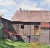 This artwork titled "Earl Scwaiger's Barn" c.1980 is a watercolor on paper by American artist W. Ralph Murray, 1932-2009....