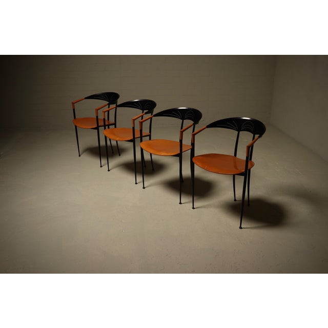 Set of 4 dining chairs produced by Tetide Italy in 1980s. These chairs embody the bold and playful spirit of postmodern...