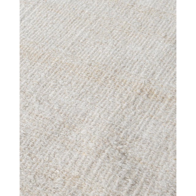 This oversized hand-woven flatweave hemp rug perfectly captures simplicity and boldness, allowing it to effortlessly...