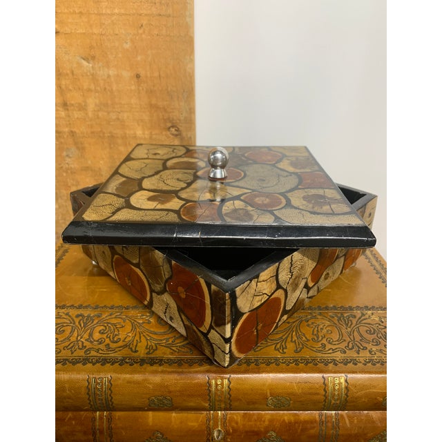 Lacquered Wooden Lidded Box with Inlaid Exotic Tree Ring Veneer. Round Lucite Feet and a Polished Chrome Knob.