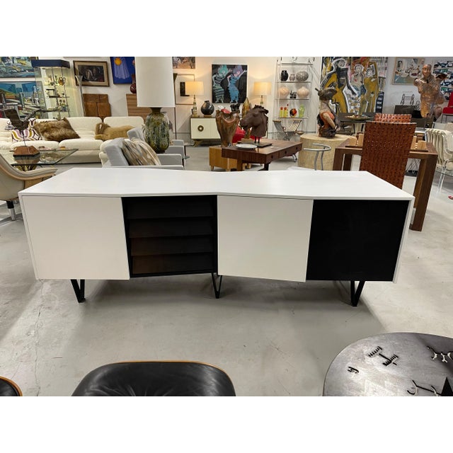 A spectacular 2 sided credenza with an angled shape. Each side has 10 drawers with two doors that can "hide" the drawers...
