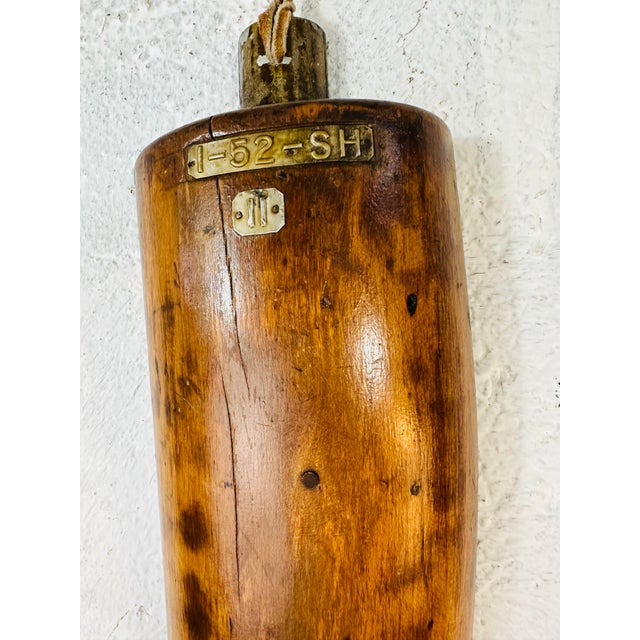 This antique wooden boot form is also known as a boot last or boot tree. These were traditionally used by shoemakers or...