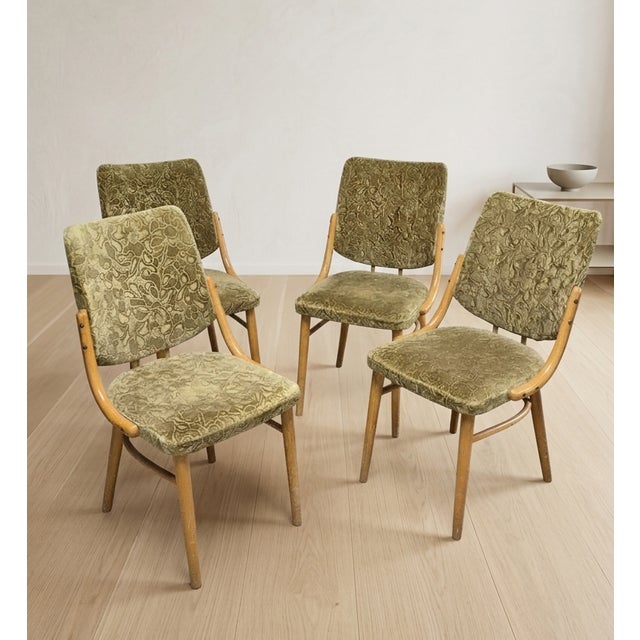 Original retro dining chairs produced by TON in former Czechoslovakia during the 1960s–1970s. The design features a...