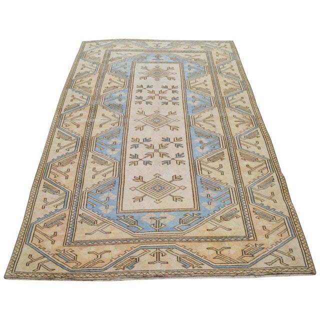 Hand-knotted with care using traditional rug-making techniques, this wool rug blends timeless craftsmanship with a modern...