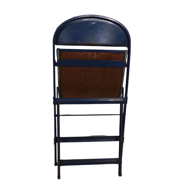 Set of four industrial grade folding chairs, constructed of steel, chrome and oilcloth. Interesting modernist...