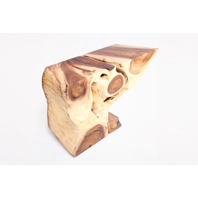 Inspired by the beauty of natural wood form and grain, this organic console table is handcrafted from one piece of wood....