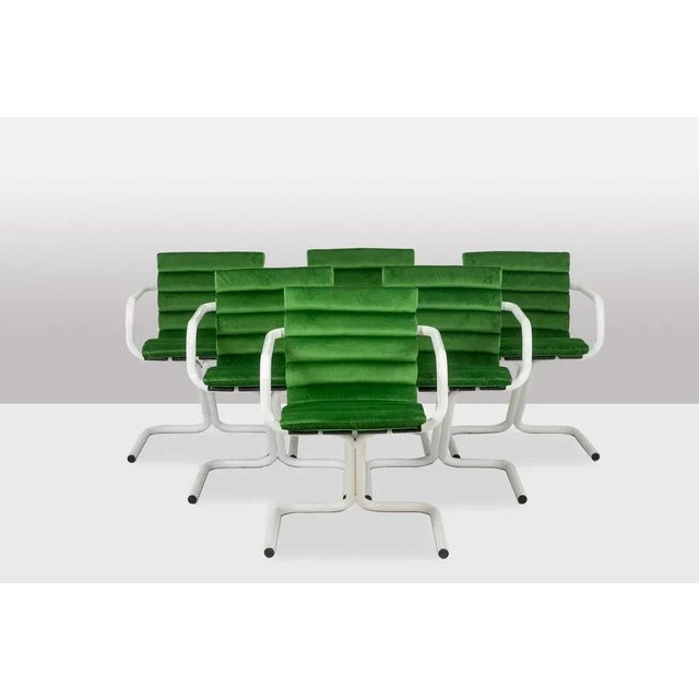 Series of 6 armchairs in white lacquered metal and green velvet, with their rollers. Danish work realized in the 1970s....