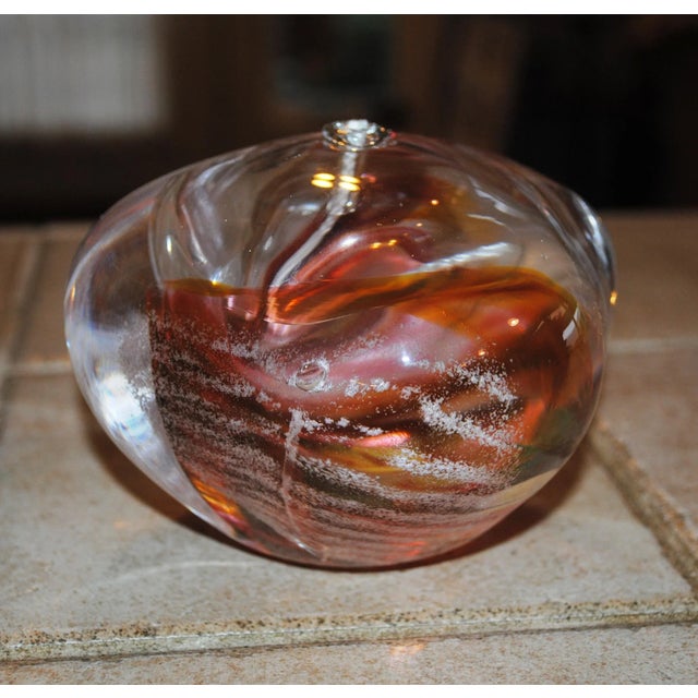 One of a kind hand blown glass paperweight and oil lamp combination. This paperweight is an abstract design with three...