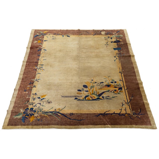 Elevate your space with this Antique Chinese Art Deco rug from the 1920s. Hand-knotted from wool, it features a...