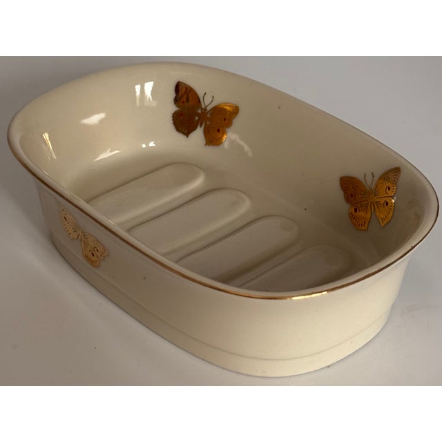Presenting a darling porcelain soap dish decorated in gold gilt butterflies and red dot accents. The porcelain itself is...