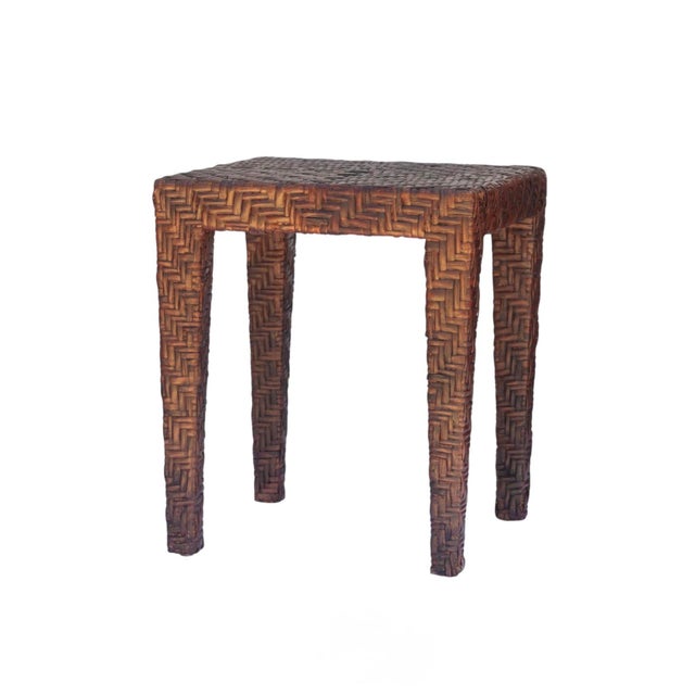 Vintage woven rattan side table featuring a classic Parsons-style silhouette in a dark brown finish. Constructed from...
