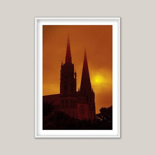 Morning sunshine breaks through the mist at Chartres Cathedral (Cathédrale Notre-Dame de Chartres). Vast and commanding,...