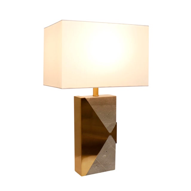 Featuring a geometric design consisting of marble and gold metal the Triumph lamp is as much a work of contemporary art as...
