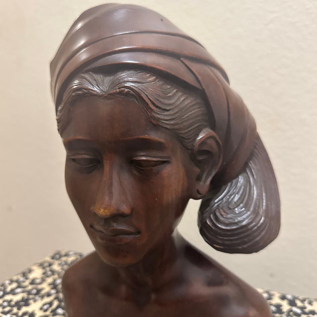 This stunning vintage bust depicts a Balinese woman in an elegant Art Deco style. Hand-carved from a rich, dense...